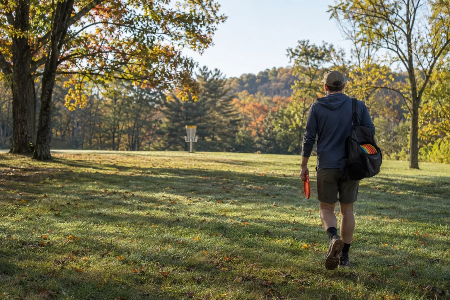 Illustration of a player walking toward a basket on a park fairway